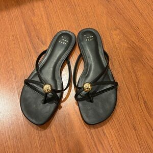 Black sandals with gold